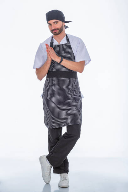 istock Doctor in a white photo studio modeling his anti-fluid uniforms. 1700731838