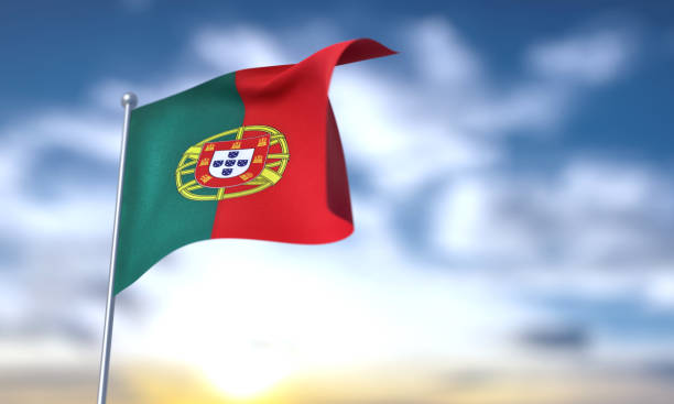 istock Portuguese Flag On Blue Sky 1700734606