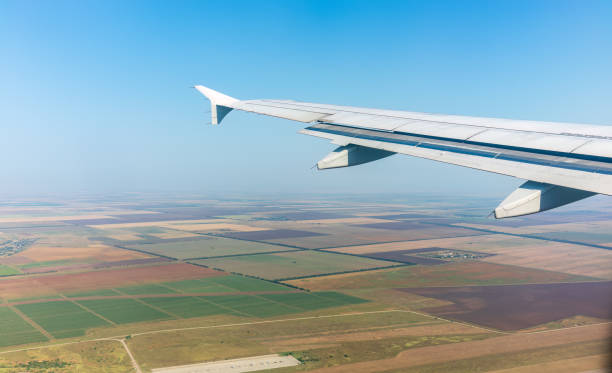 istock View from the airplane window during taking off on a clear summer morning 1700739027