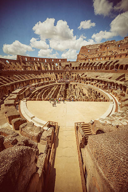 Inside the Coliseum of Rome Inside the coliseum, where gladiators once fought. inside the colosseum stock pictures, royalty-free photos & images