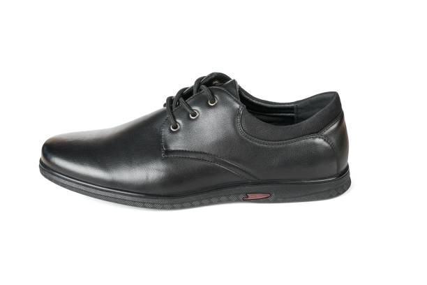 istock Classic men's black leather shoe, isolated on a white background. 1700750169