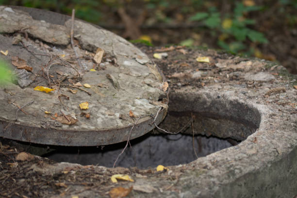 istock metal manhole cover, open old well 1700764219