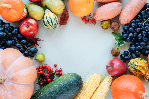 istock Autumn harvest frame: pumpkins, apples, pears, corn, grapes and other fruits and vegetables. Top view, flat lay, copy space 1700772928