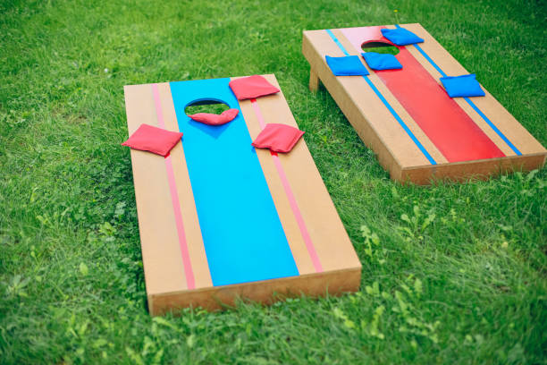 istock Homemade corn hole board game in backyard 1700808441