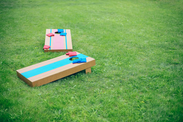 istock Homemade corn hole board game in backyard 1700810102