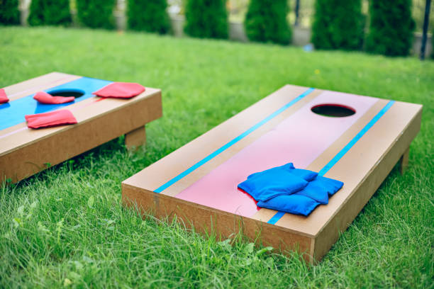 istock Homemade corn hole board game in backyard 1700812276