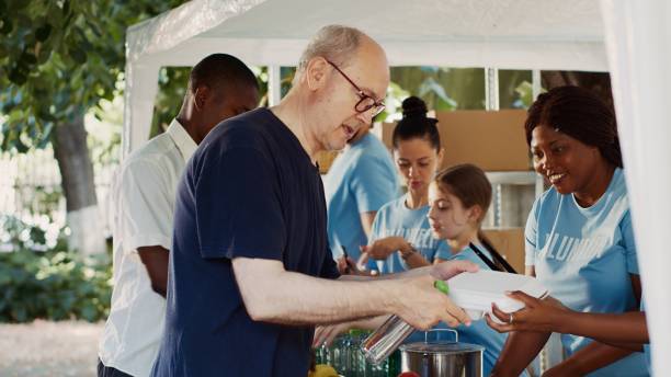 istock Volunteers Offer Hunger Relief To Needy 1700827376