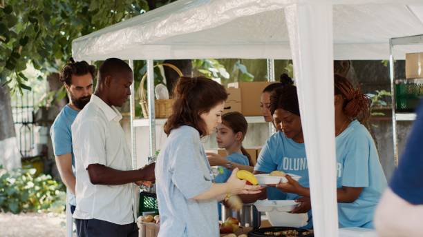 istock Charity Workers Distribute Free Meals 1700831225