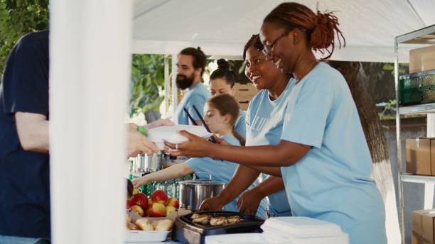 istock Volunteer Team Helping The Homeless 1700832913