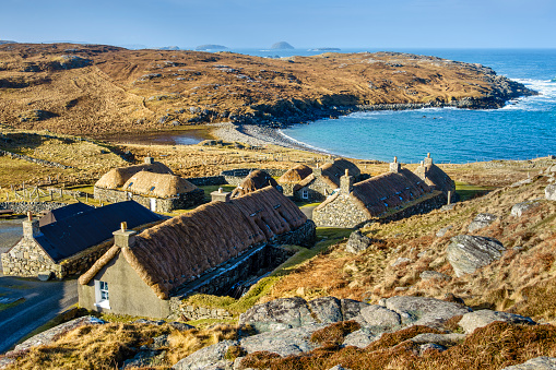 Blackhouses at Gearrannan on the Isle of Lewis. Traditional crofting houses dating from the late 19th century  looking over the Atlantic Ocean.