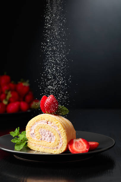 istock Delicious strawberry biscuit cake sprinkled with sugar powder. 1700850116