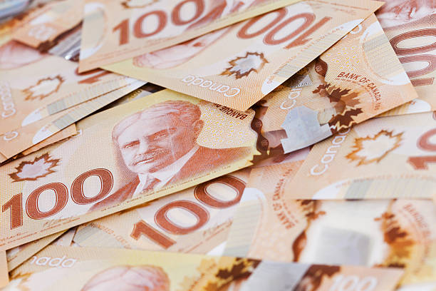 istock Pile of Canadian $100 bills issued in 2012 170085561