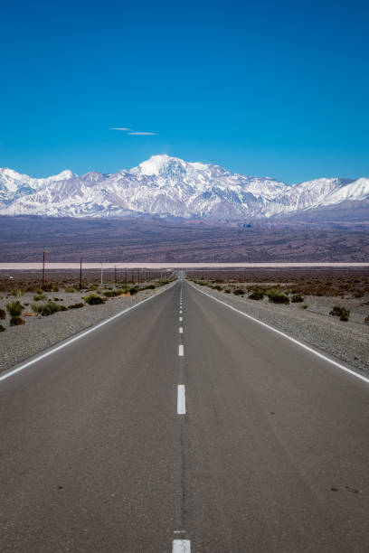 istock Road in the middle of the desert. 1700856936