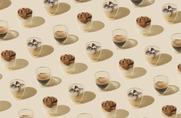 istock Creative trendy pattern made of different types of coffee drinks on pastel background. Minimal coffee concept. Fancy pattern background idea. Coffee aesthetic. 1700862440