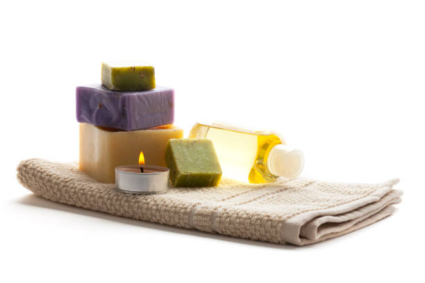 istock Spa setting with candle, towel, soaps and bottle 170086689