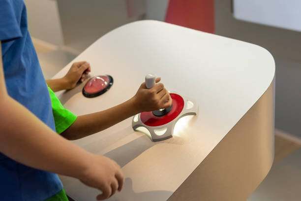 istock The child controls the manipulator with a joystick 1700880798