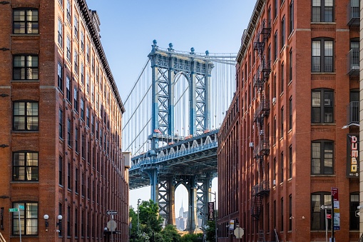 The Manhattan Bridge between buildings in the Dumbo neighborhood in Brooklyn, NYC