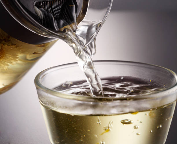 istock Jug Of chrysanthemum tea, pouring tea 1700882511