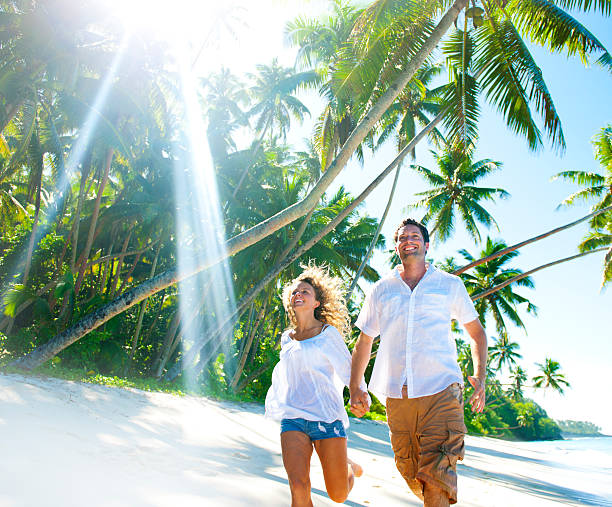 istock Young Couple relaxing on an idyllic tropical beach 170088883