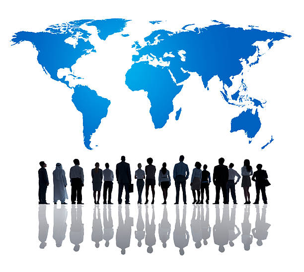 istock Silhouette of business people looking at world map 170089048