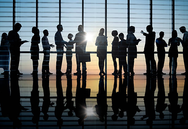 istock Business people in silhouette on sunset backdrop 170089096