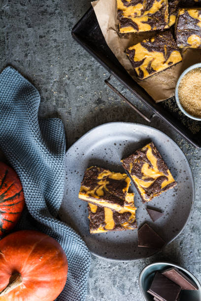 istock Delicious fall dessert, Pumpkin swirl brownies 1700892594
