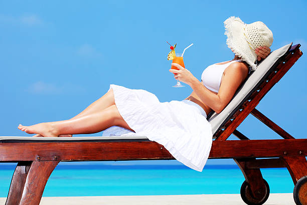 Young woman enjoying in cocktail.