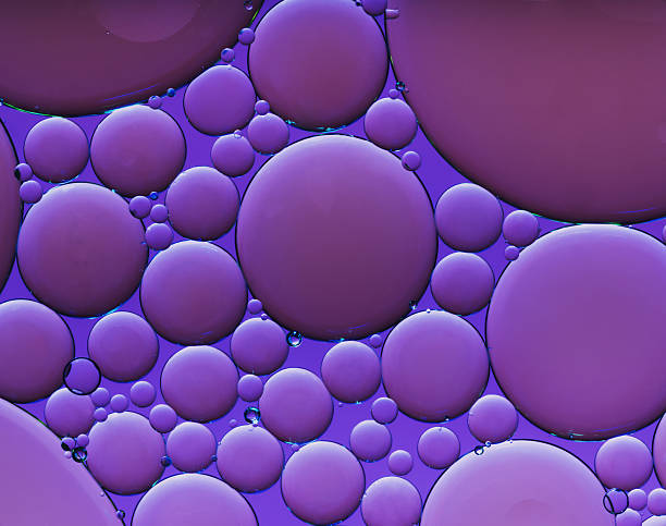 istock purple oil drops on water 170091531