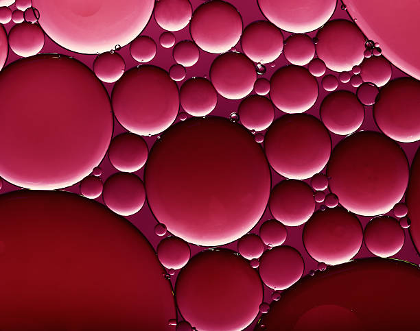 istock purple oil drops on water 170091536