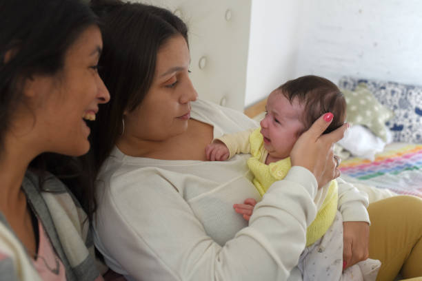 istock women with baby in room 1700922671