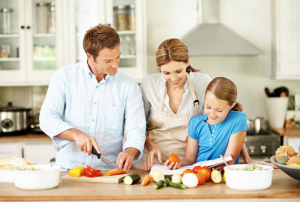 istock Learning how to cook with mum and dad 170093951