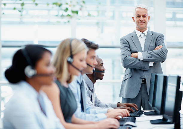istock Confident manager with young business team at a call center 170093982