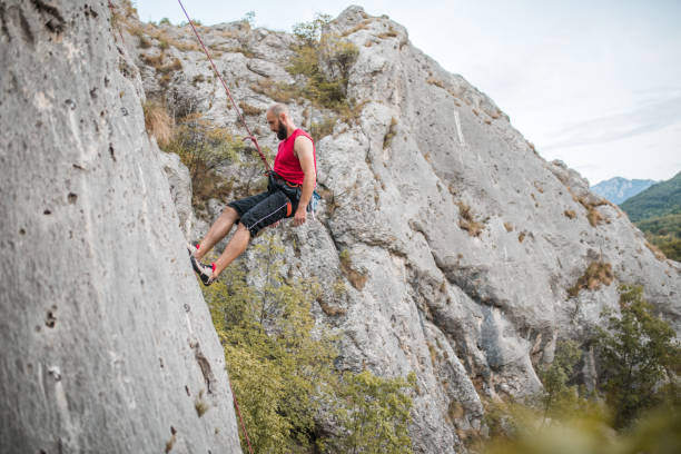 istock A focused male climber overcomes extremely steep terrain by climbing a mountain 1700943386