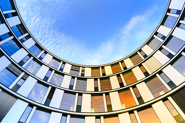 Modern Office Architecture Glass facade of a modern office building in Hamburg, Germany. coloured glass texture stock pictures, royalty-free photos & images