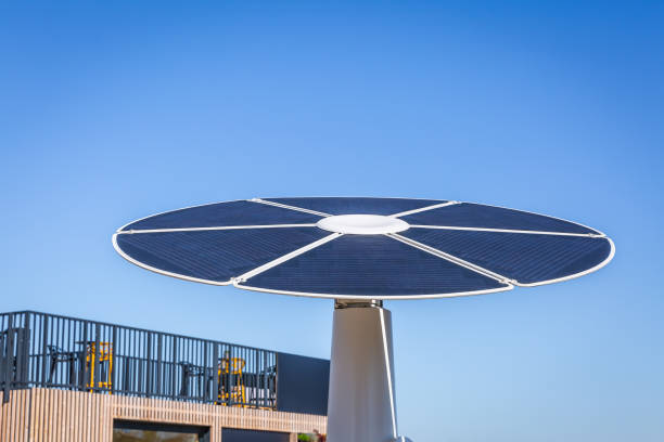 istock Rotating solar panel in flower shape in a city. Photovoltaic, alternative electricity source 1700948555