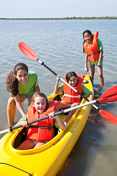 istock Girls in a double kayak 170094889