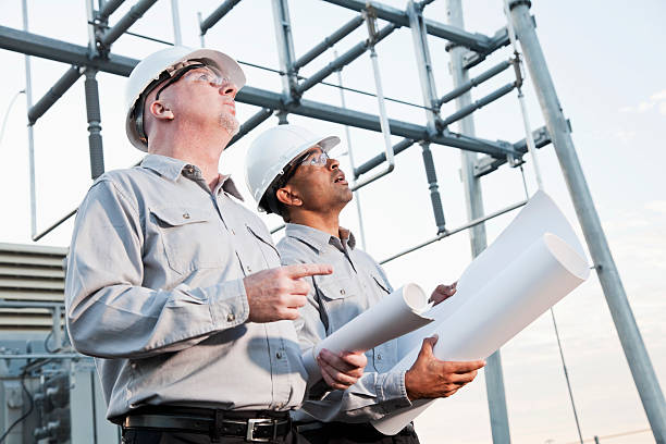 istock Multiracial engineers at industrial site looking up 170094902