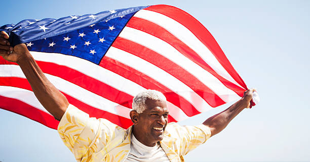 istock African American Senior Carrying USA Flag 170094927