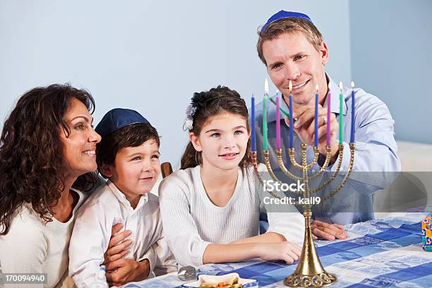 Jewish Family Celebrating Hanukkah Stock Photo - Download Image Now - Hanukkah, Judaism, Menorah