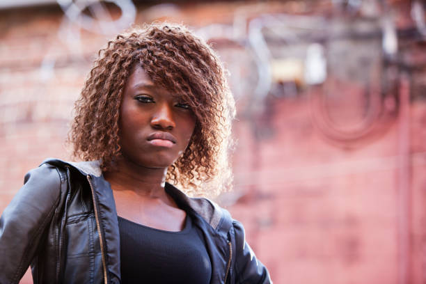 istock Young black woman standing in back alley 170094952