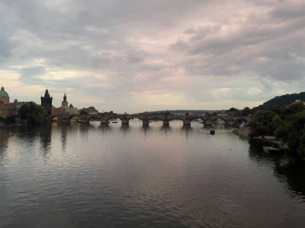 istock Prague's Charles Bridge at Sunset with Reflecting Sky 1700949605