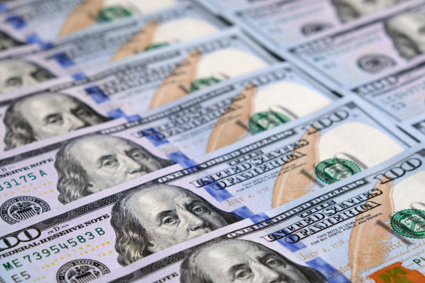 istock Lots of 100 American dollar bills. 1700950672