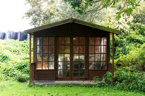 istock Wooden shed with glass doors and windows 1700959355