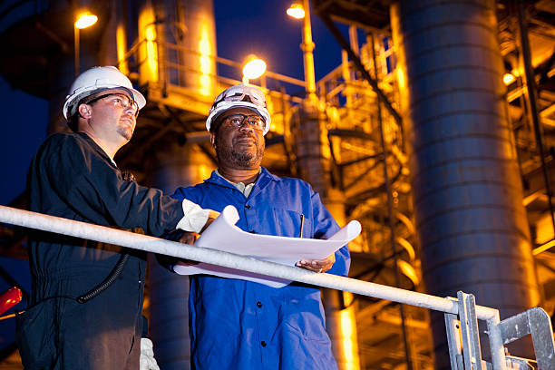 istock Chemical plant workers at night 170095984