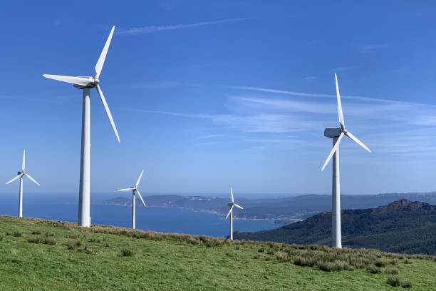 istock wind power plants against a blue sky with clouds on a bright sunny day 1700959890
