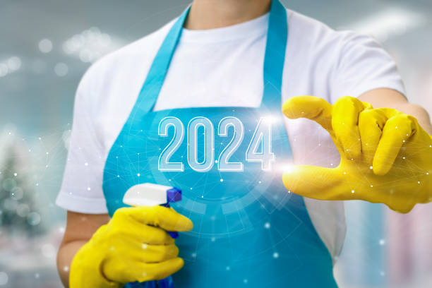 istock Cleaning lady shows the new year 2024. 1700968037