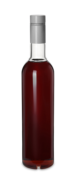 Bottle of delicious syrup for coffee on white background