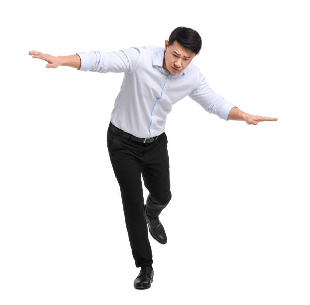 istock Businessman in formal clothes posing on white background 1700977876