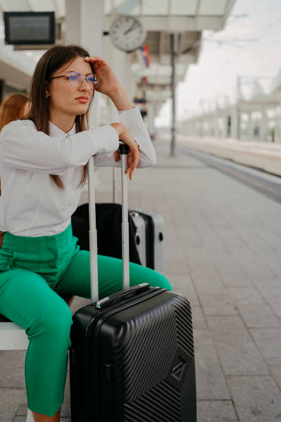 istock Young woman at the train station 1700977882