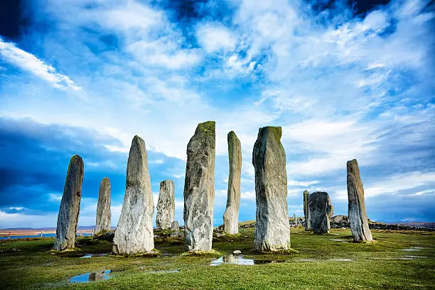 The ancient standing stones of Callanish (or Calanais) on Lewis in the Outer Hebrides of Scotland. Built about 5000 years ago, the deeply textured stones of Callanish are arranged in allignments of avenues and a central circle not unlike a celtic cross.